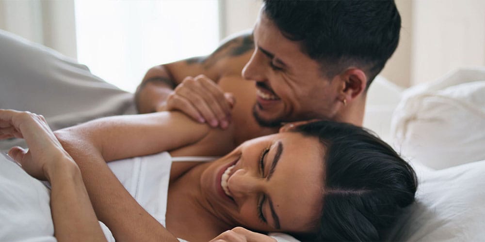 happy couple in bed together after the P-Shot in Denver