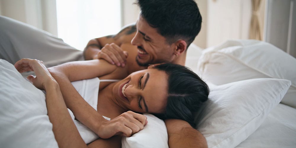 happy couple in bed after getting the P-Shot in Denver